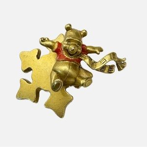 Disney Winnie the Pooh sliding down a golden snowflake winter brooch pin
